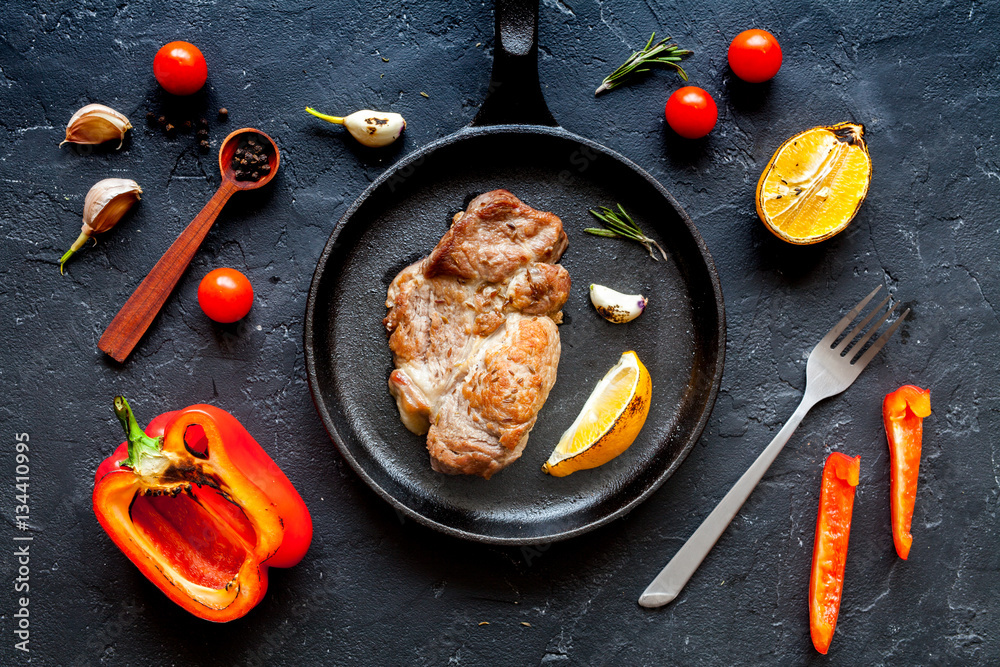 concept cooked steak on dark background top view