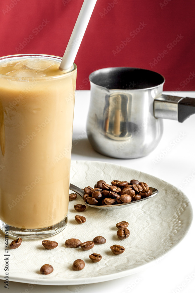 coffee with ice in glass on white background