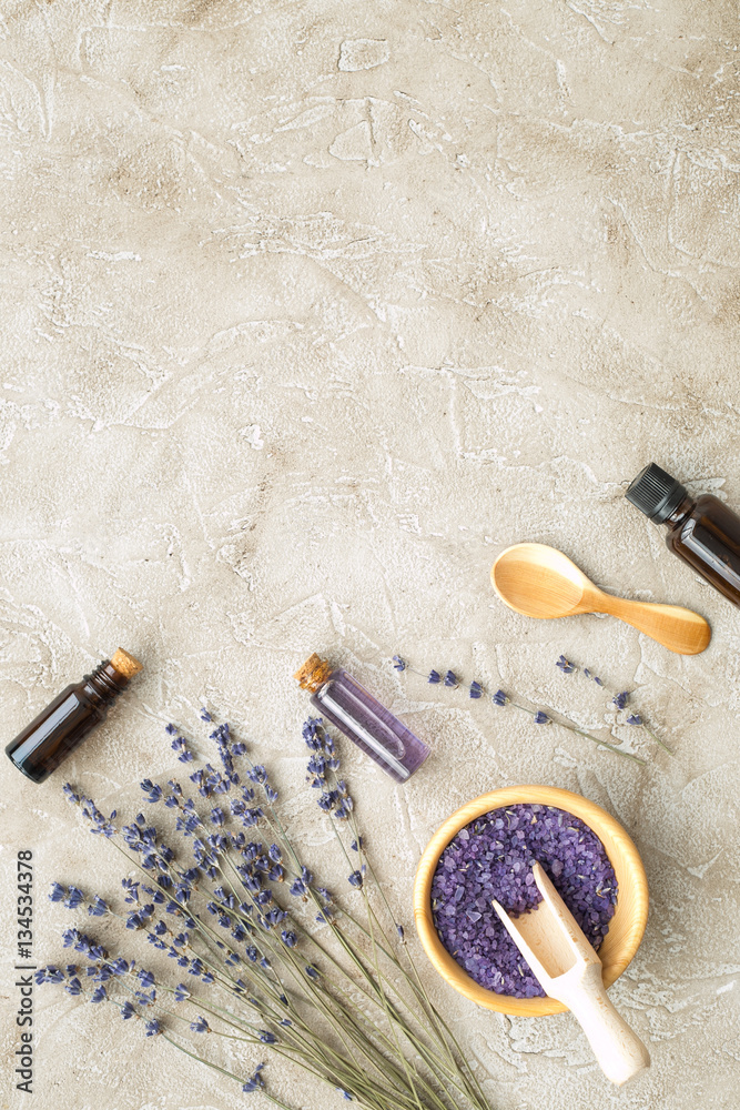 Essential oil and lavender salt with flowers top view