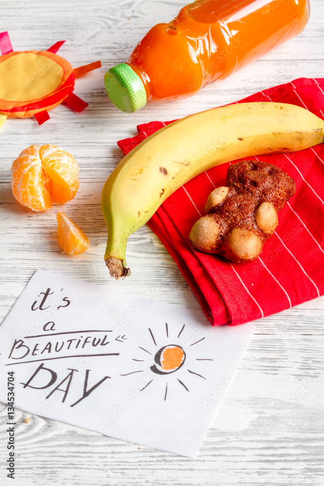 lunch box for kid with fresh vegetables on wooden background