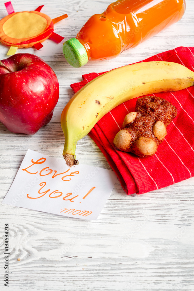 lunch box for kid with fresh vegetables on wooden background