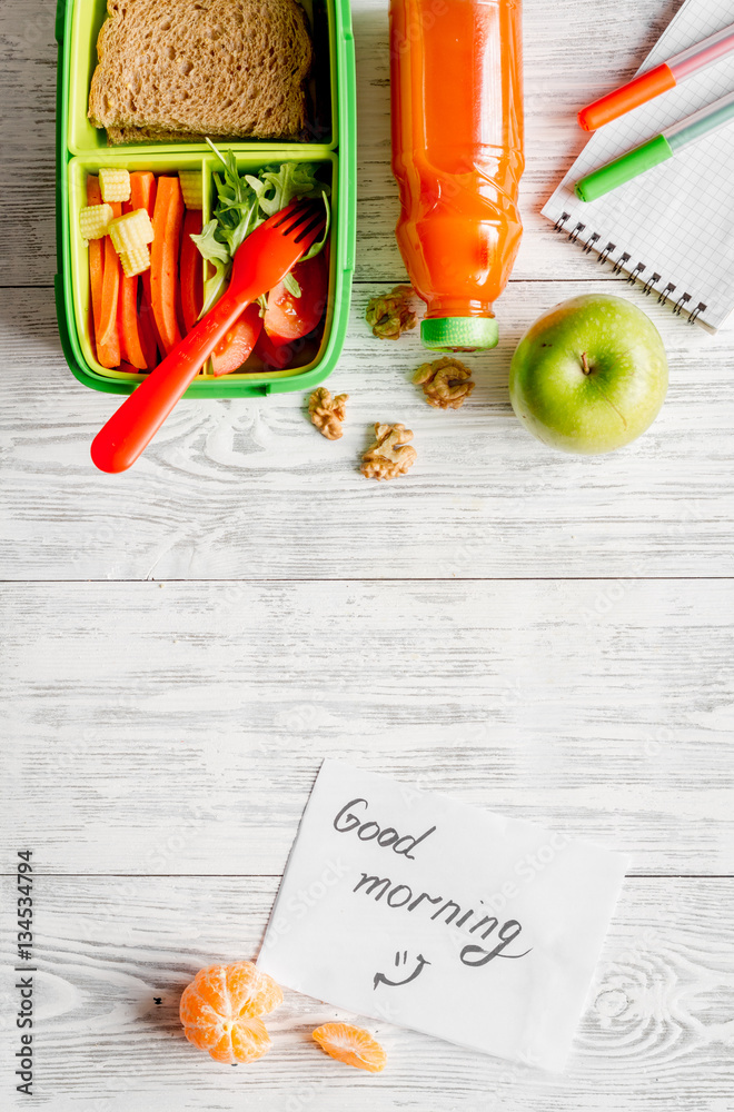 kid menu lunchbox for school top view on wooden background