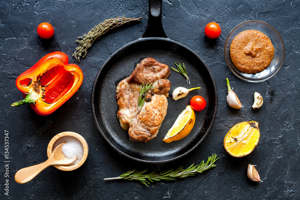 concept cooked steak on dark background top view