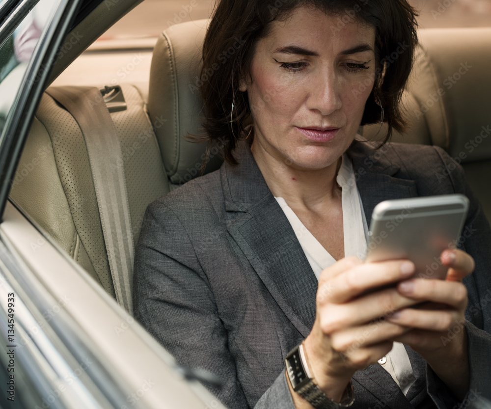 Businesswoman Talking Using Phone Car Inside