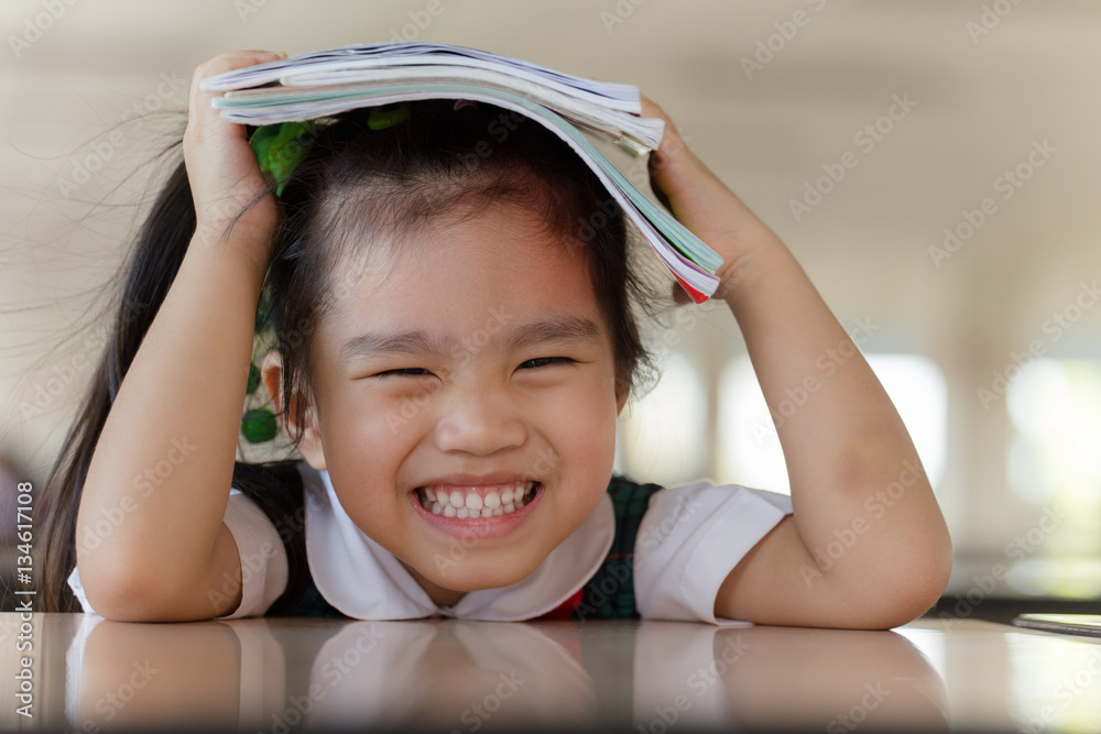 education and school concept asian (japan, chinese, korea) pretty girl hold a book and reading