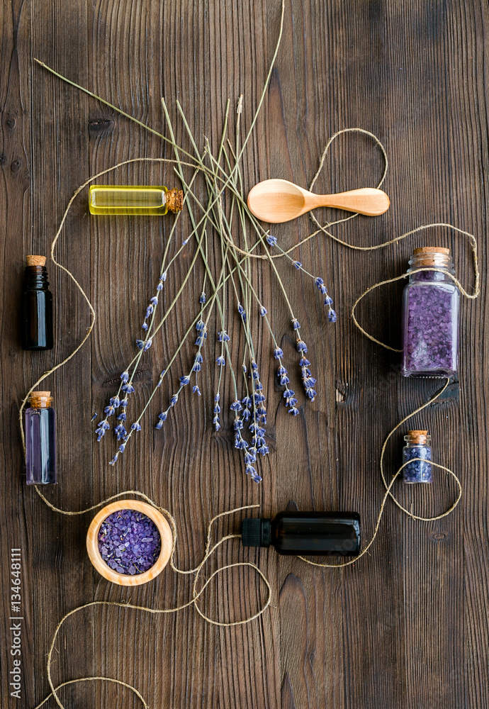 organic cosmetics with lavender on wooden background top view