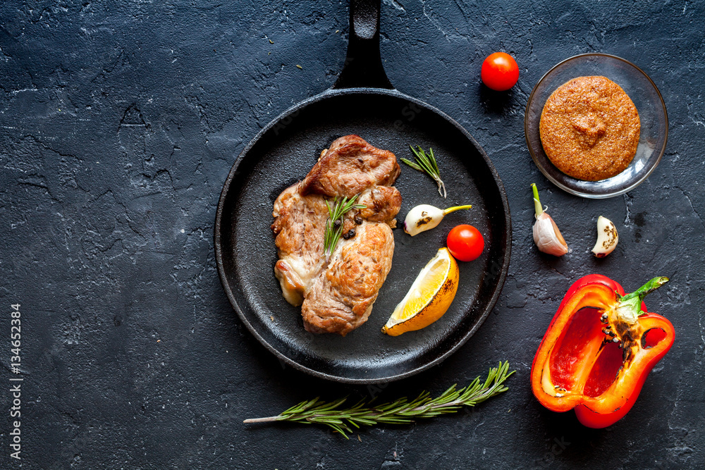 concept cooked steak on dark background top view