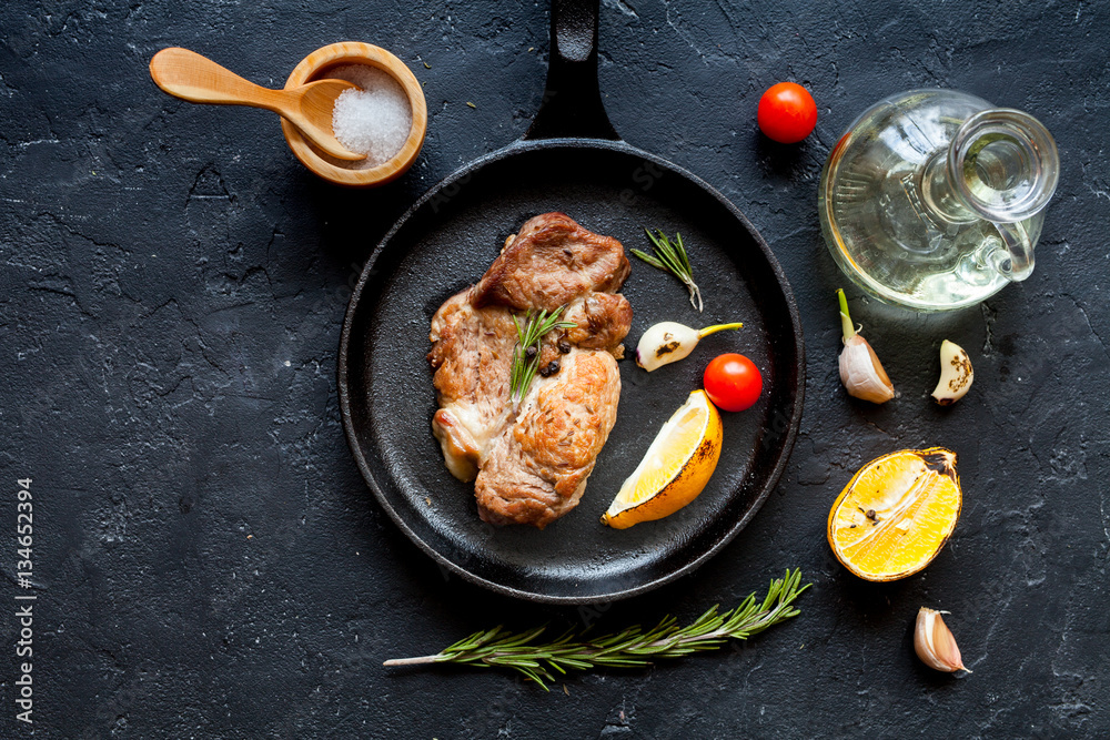 concept cooked steak on dark background top view