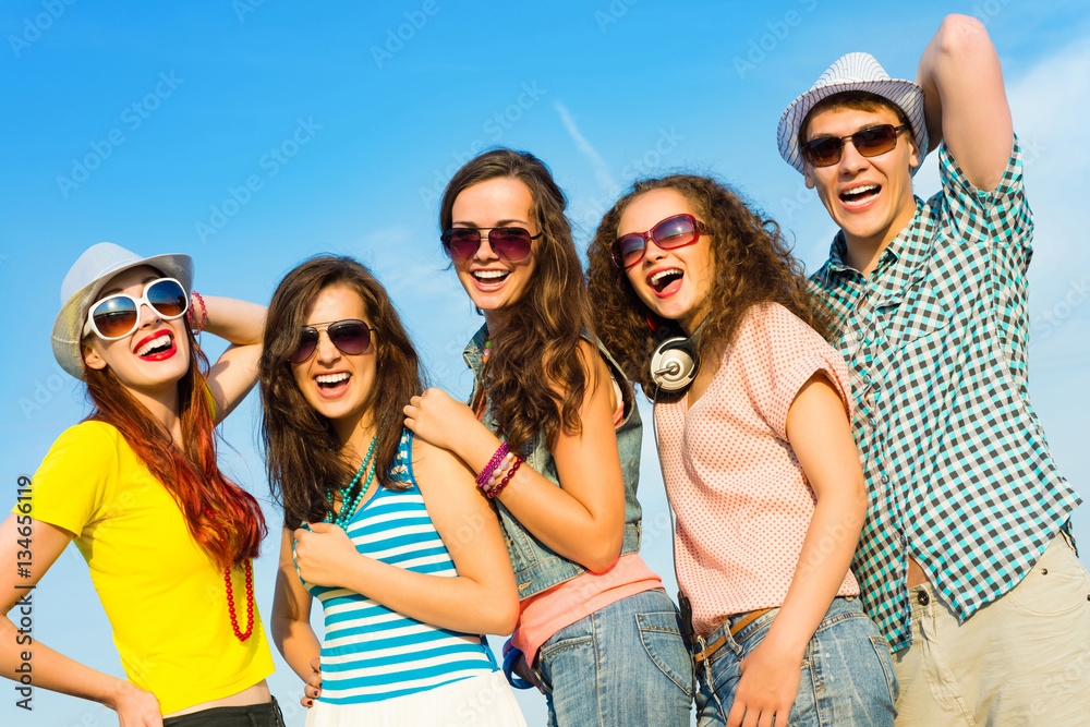 group of young people wearing sunglasses and hat