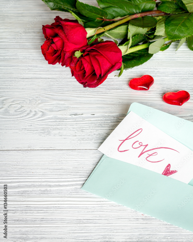 concept Valentines Day with flower wooden background top view