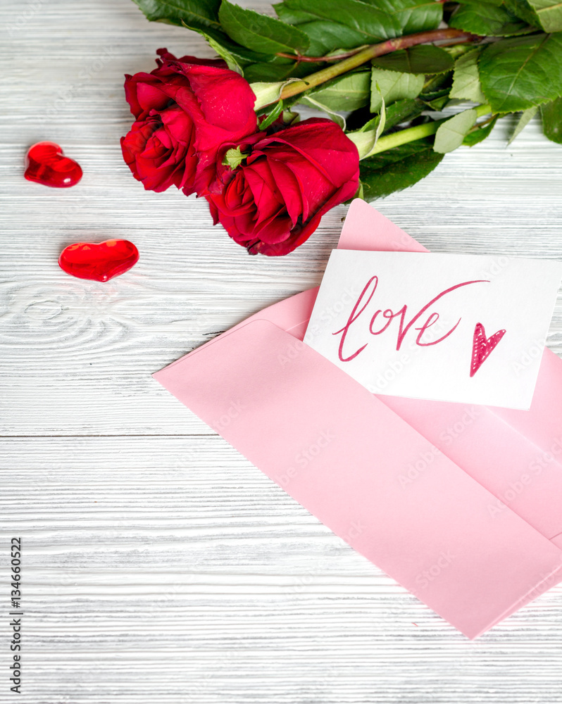 concept Valentines Day with flower wooden background top view