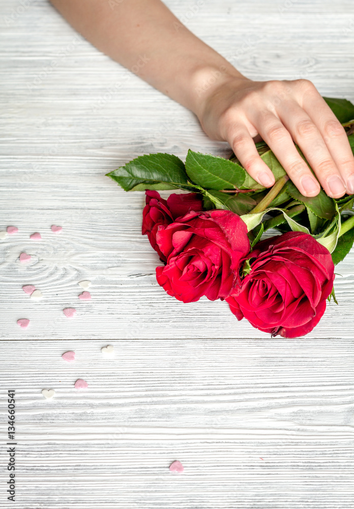 concept Valentines Day with flower wooden background top view