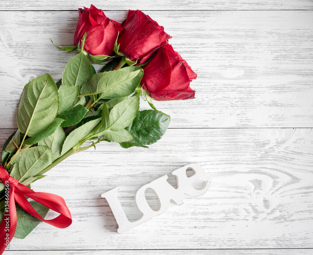 concept Valentines Day with flower wooden background top view