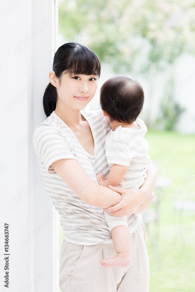 portrait of asian mother and baby in the park