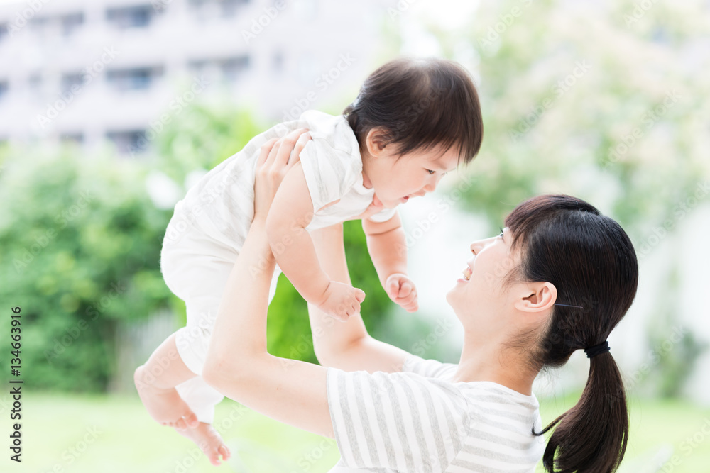 portrait of asian mother and baby in the park