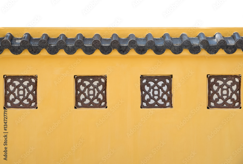 Yellow concrete fence wall with roof in chinese exterior style