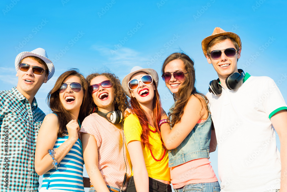 group of young people wearing sunglasses and hat