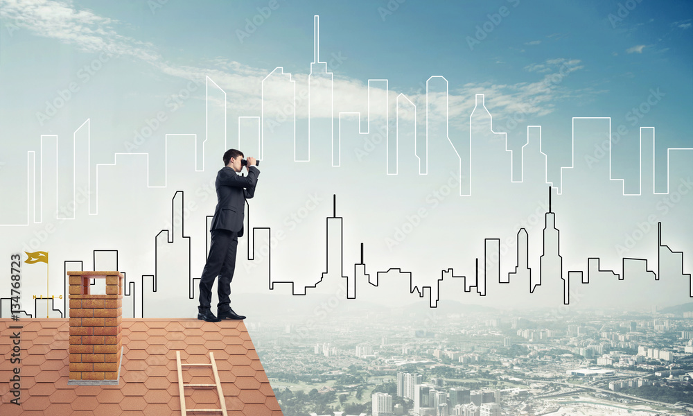 Businessman standing on roof and looking in binoculars. Mixed me