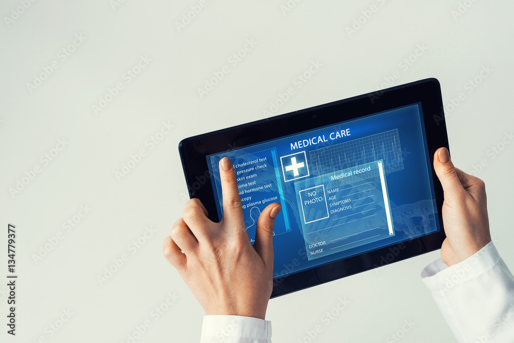 Close of female doctor hands working with tablet pc computer