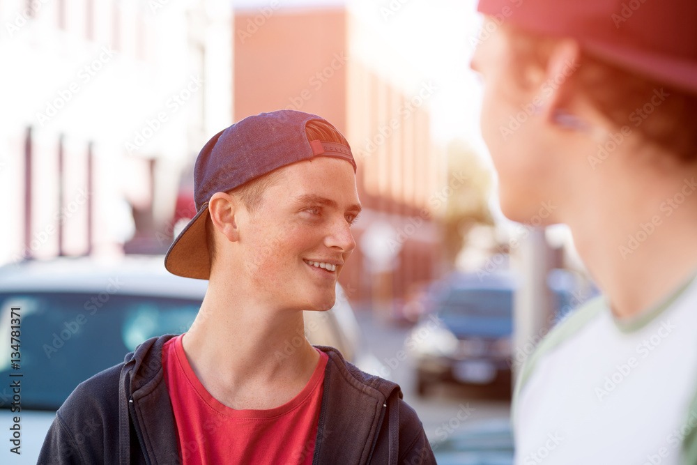 Guys skateboarders in street