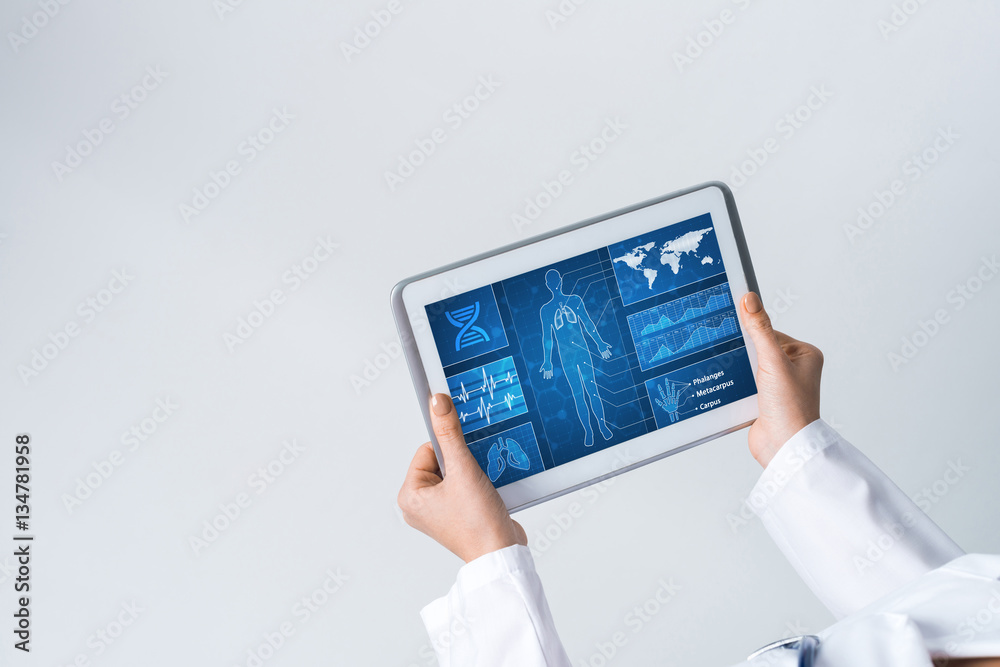 Close of female doctor hands working with tablet pc computer