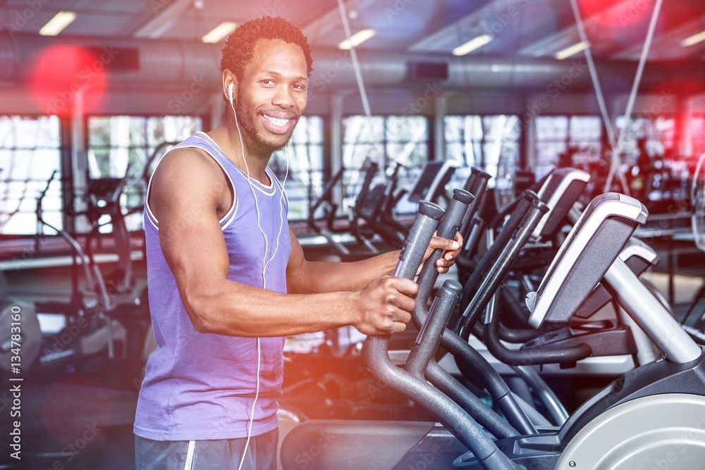 Smiling man working out with headphones