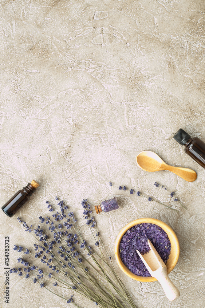 Essential oil and lavender salt with flowers top view