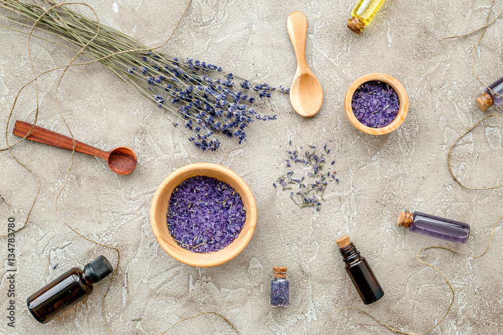 Essential oil and lavender salt with flowers top view