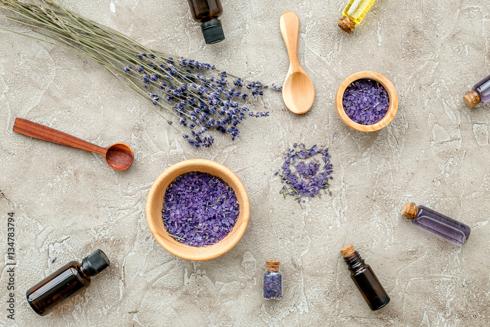 Essential oil and lavender salt with flowers top view