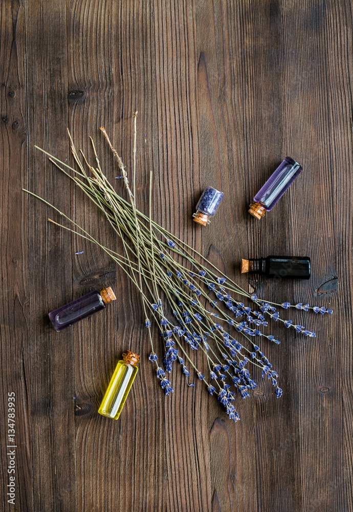 organic cosmetics with lavender on wooden background top view