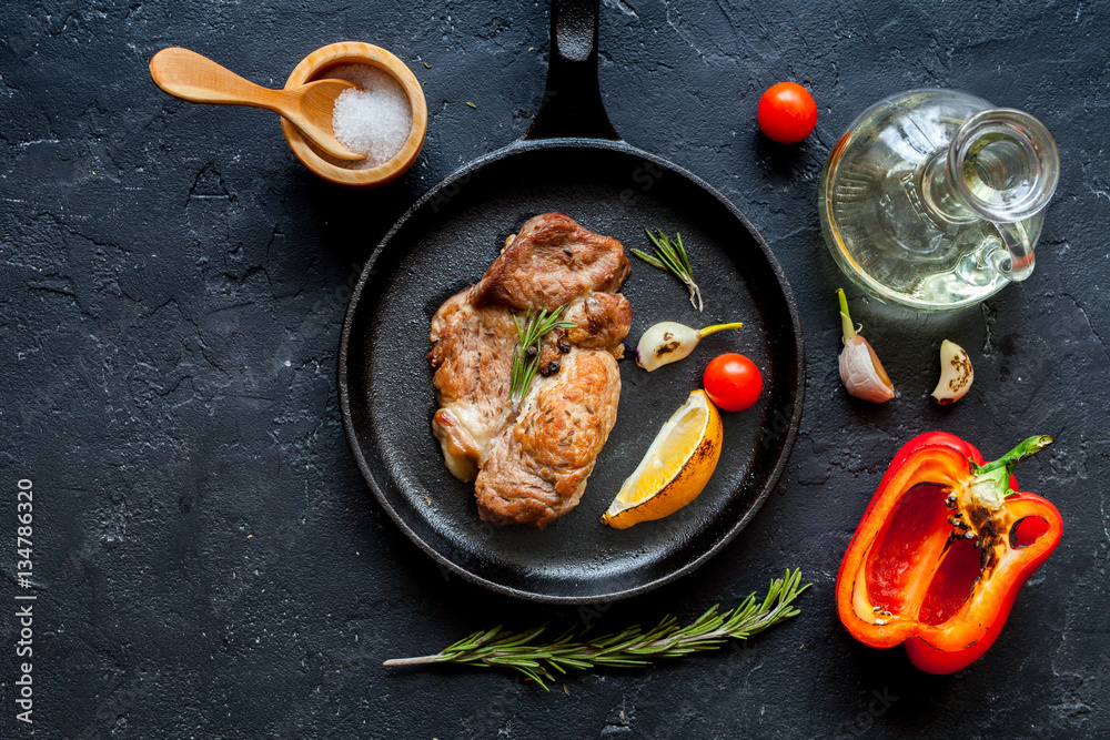 concept cooked steak on dark background top view