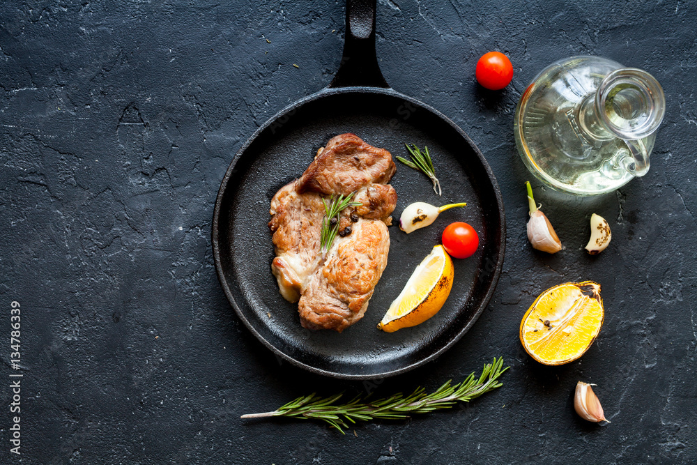 concept cooked steak on dark background top view