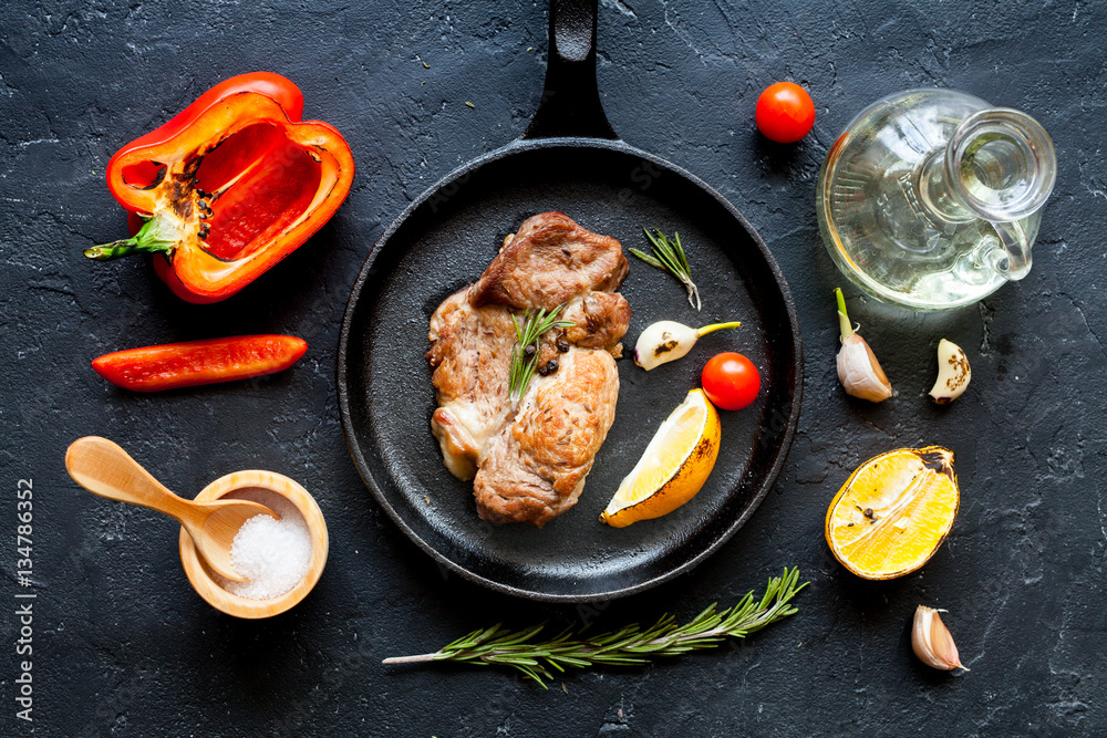 concept cooked steak on dark background top view