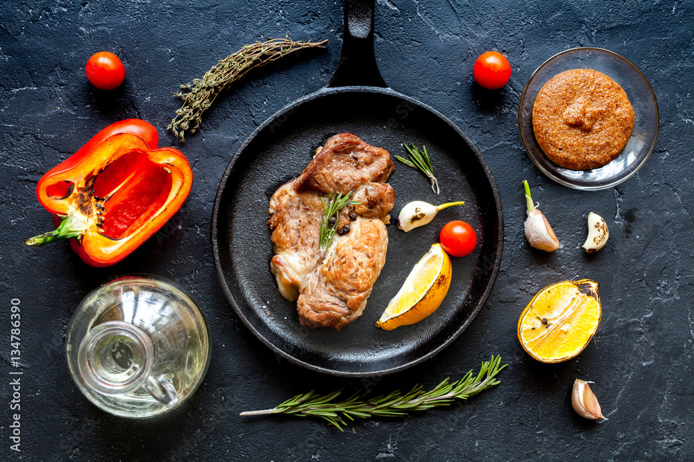 concept cooked steak on dark background top view