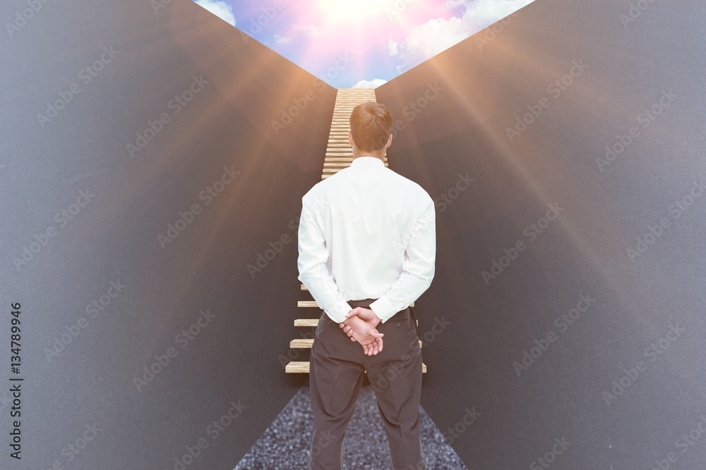 Composite image of businessman turning his back to camera 3d