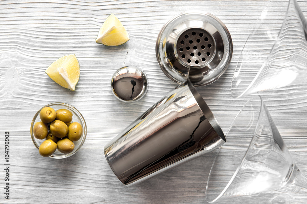 martini and shaker top view of wooden background