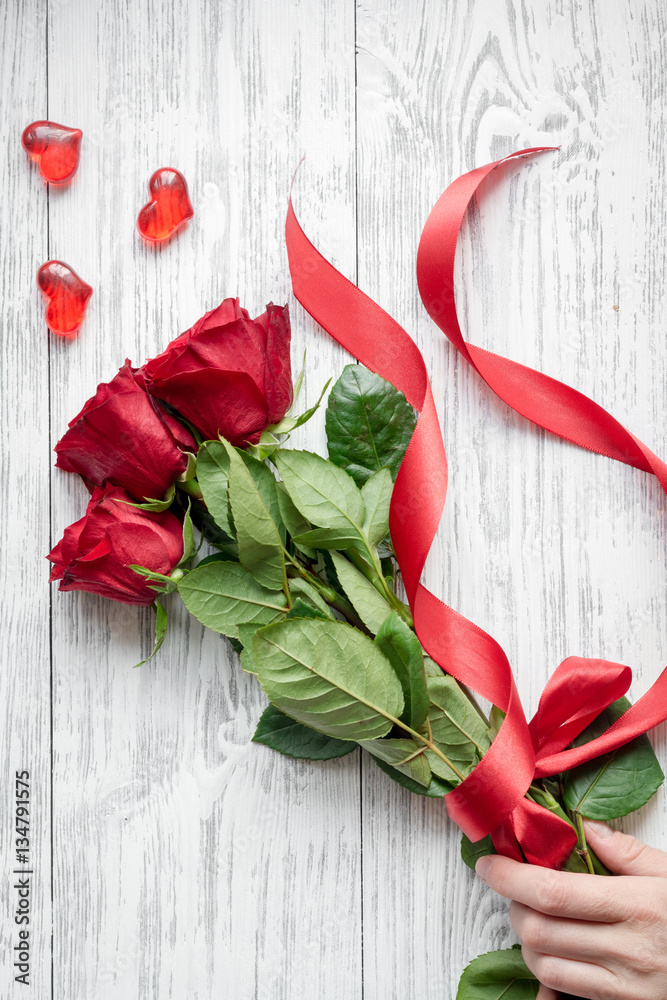 concept Valentines Day with flower wooden background top view