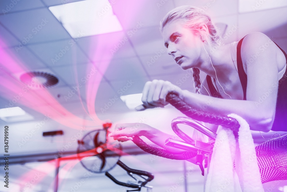 Fit woman on exercise bike