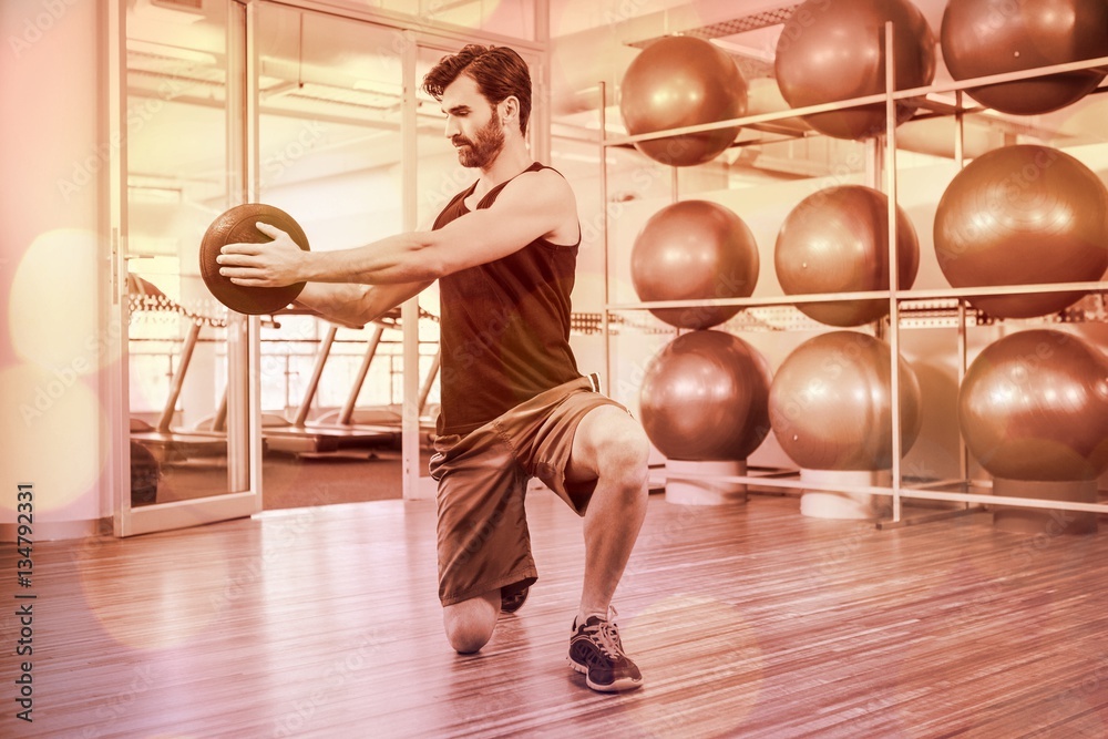 Man doing exercise with medicine ball