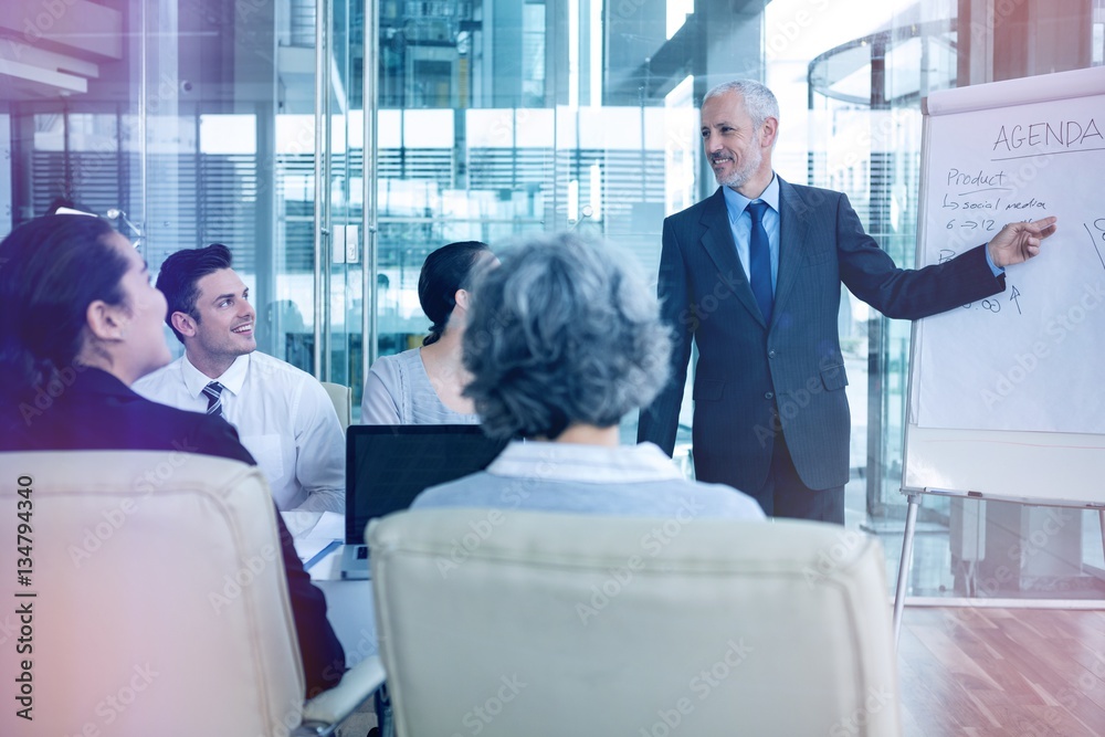 Businessman interacting with colleagues