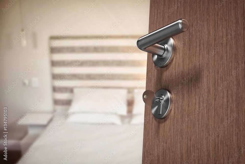 Composite image of low angle view of brown door with key