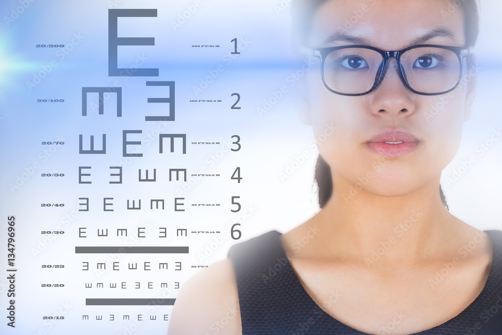 Composite image of serious businesswoman wearing glasses