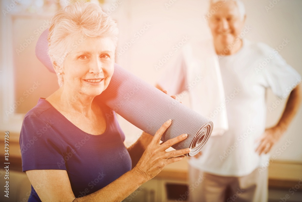 Senior couple packing up after workout