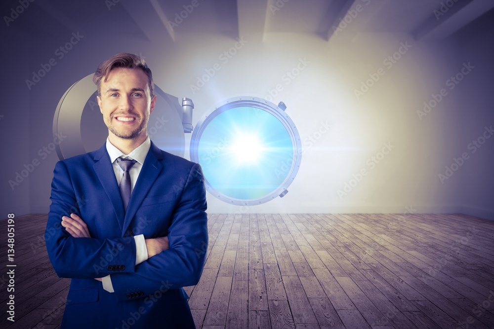 Composite image of businessman standing with arms crossed