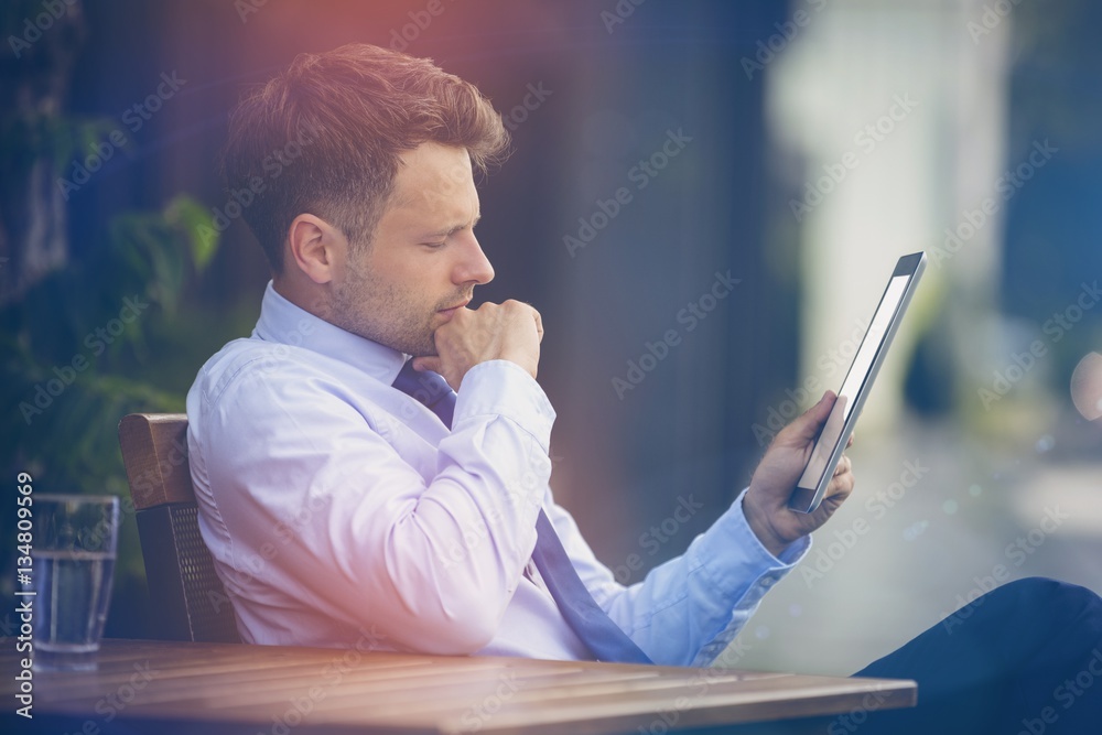 Businessman looking at digital tablet