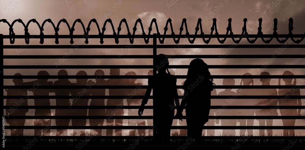 Composite image of silhouette girls holding hands