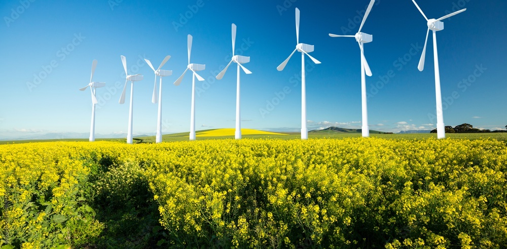 Composite image of digital composite image of wind turbines 3d