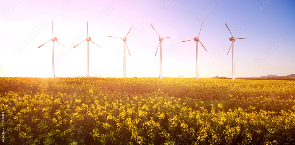 Composite image of digital composite image of wind turbines 3d