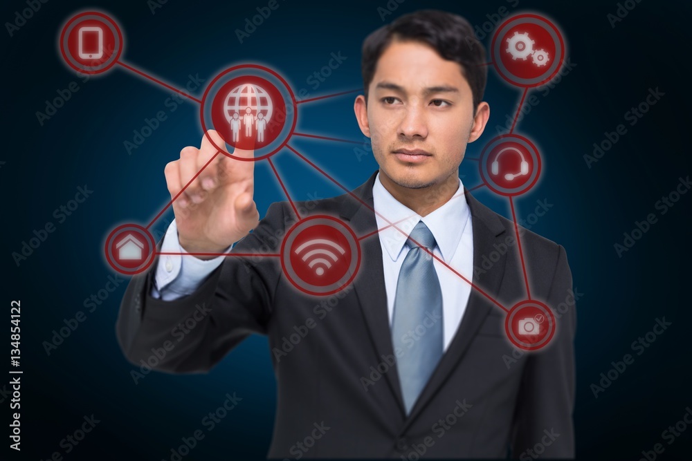 Composite image of stern asian businessman pointing