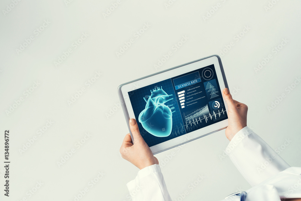 Close of female doctor hands working with tablet pc computer